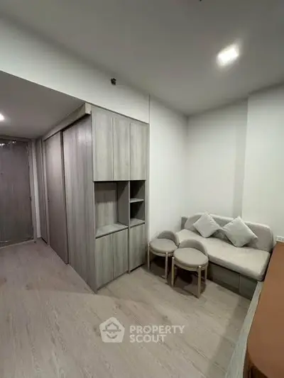 Modern living room with sleek furniture and minimalist design, perfect for urban living.
