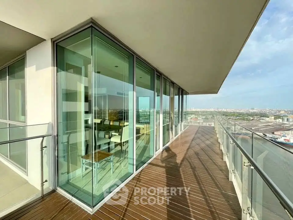 Stunning corner unit with expansive balcony and panoramic city views.