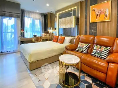 Luxurious bedroom with stylish decor and leather sofa in modern apartment