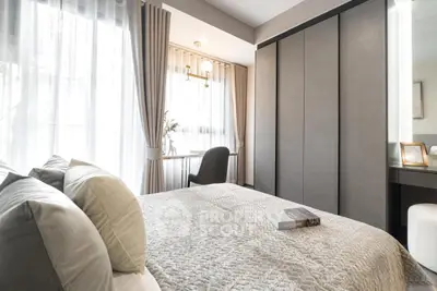 Modern bedroom with elegant decor and natural light