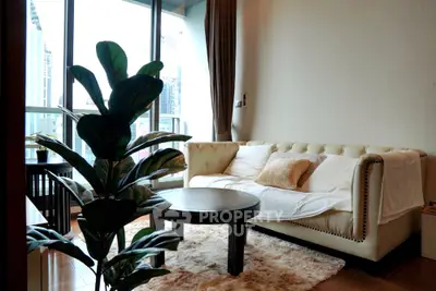 Stylish living room with modern sofa and large windows offering city views
