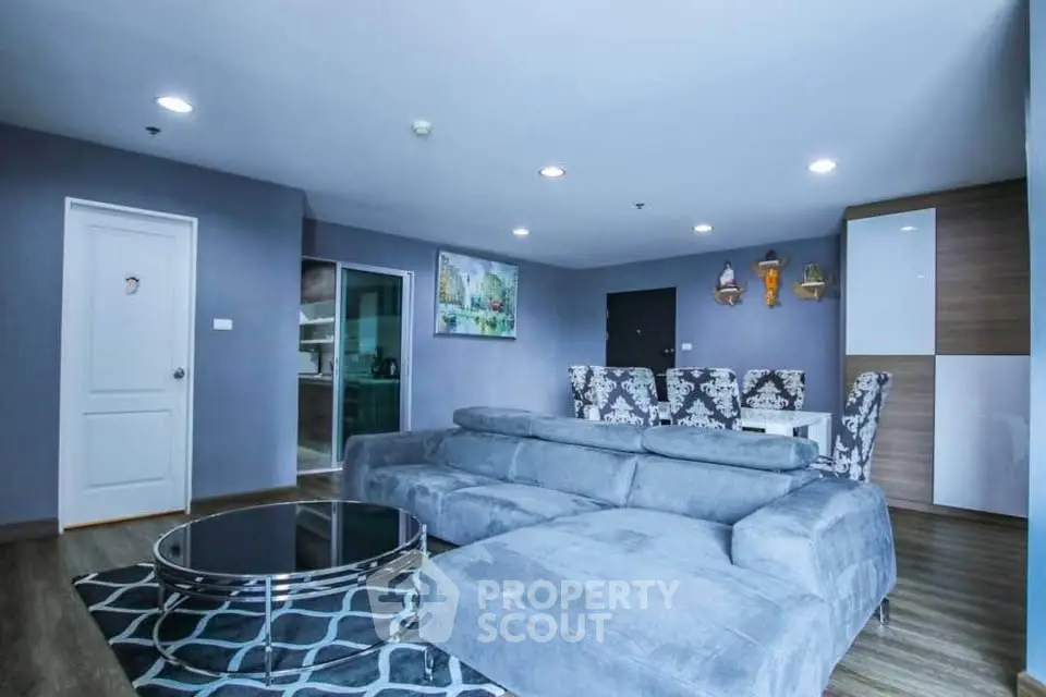 Spacious modern living room with plush gray sofa and stylish decor