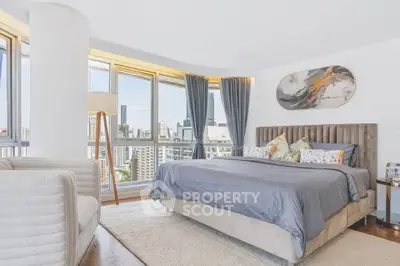 Luxurious bedroom with panoramic city views and elegant decor