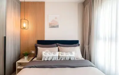 Modern bedroom with stylish decor and natural light