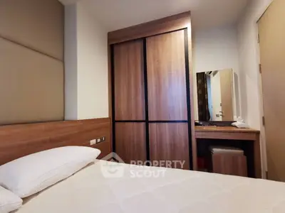 Cozy bedroom with modern wooden wardrobe and stylish vanity desk