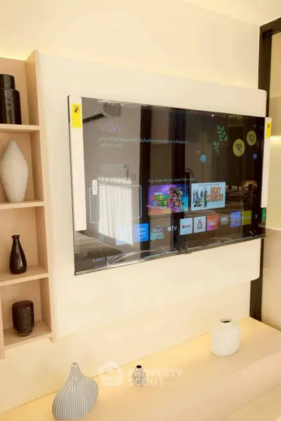 Modern living room with wall-mounted smart TV and stylish decor