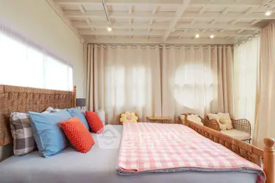Cozy bedroom with stylish decor and natural light
