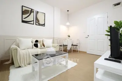 Modern living room with cozy decor and stylish furniture