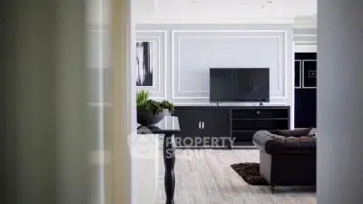 Elegant living room with modern decor and sleek TV setup