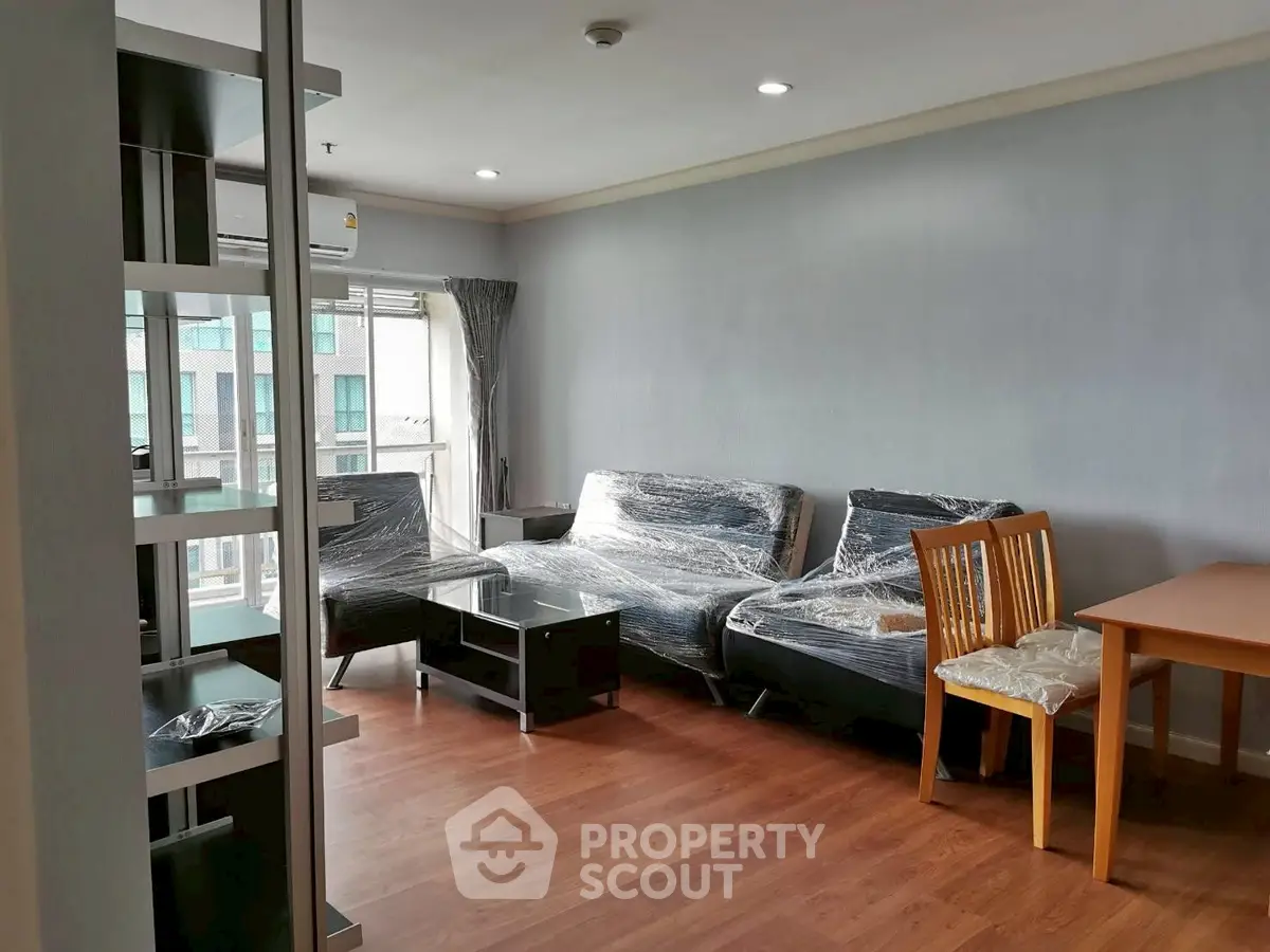 Spacious living room with modern furniture and natural light