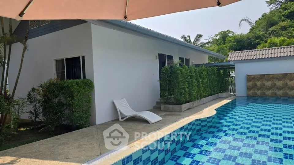 Charming villa with private pool and lush greenery, perfect for relaxation and luxury living.