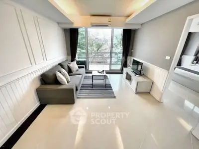 Modern living room with sleek design, large windows, and stylish furniture in a contemporary apartment.