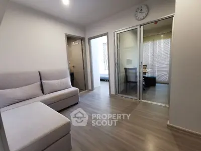 Modern living room with sliding glass doors and cozy seating area