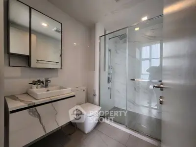 Modern bathroom with sleek design and glass shower enclosure