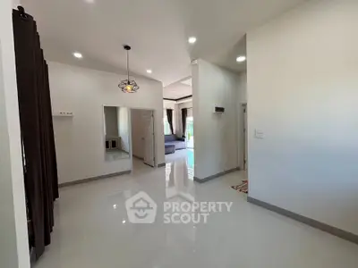 Spacious modern living area with sleek design and abundant natural light