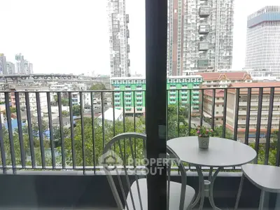 Charming balcony with city view, perfect for relaxation and enjoying the urban skyline.
