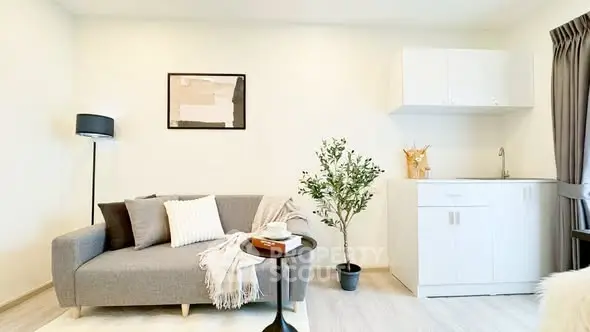 Modern living room with cozy sofa and stylish decor