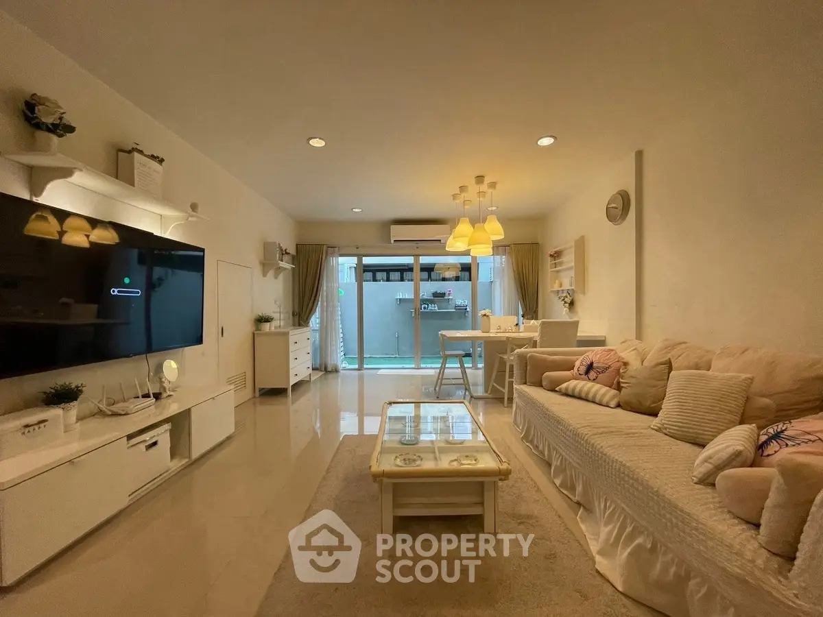 Spacious modern living room with elegant decor and open layout, perfect for family gatherings.