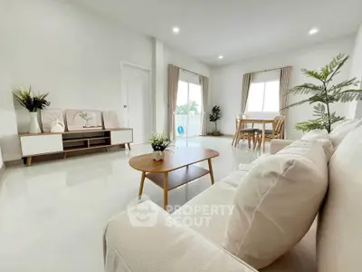 Spacious modern living room with elegant decor and natural light