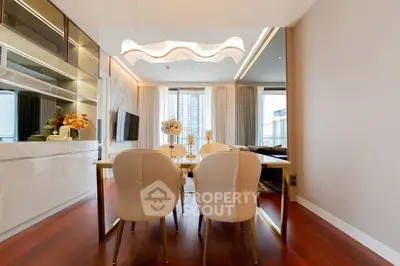 Luxurious modern dining area with elegant lighting and city view