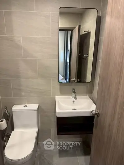 Modern bathroom with sleek fixtures and neutral tile design