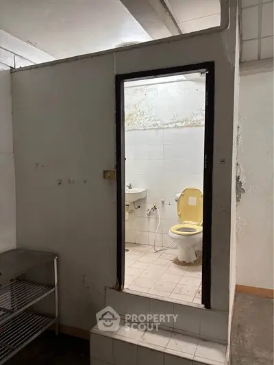 Explore potential with this fixer-upper bathroom, offering a blank canvas for renovation enthusiasts.