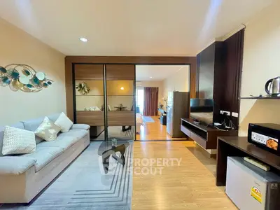 Modern open-plan living room with stylish decor and cozy ambiance