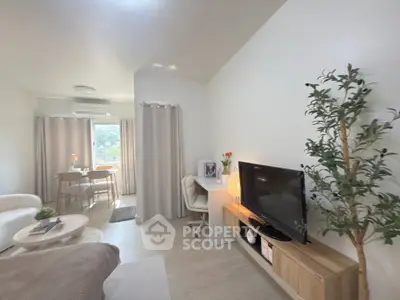 Modern studio apartment with cozy living area and natural light