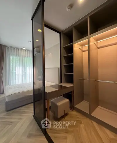 Modern bedroom with walk-in closet and elegant decor