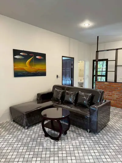 Modern living room with stylish sofa and artistic wall painting