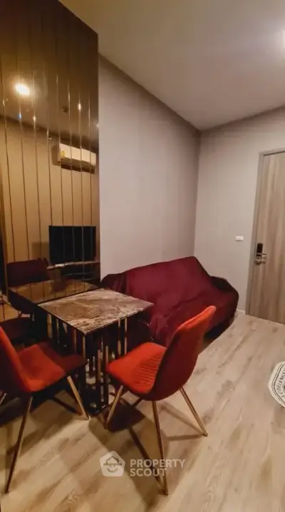 Cozy living room with modern decor and stylish furniture in a compact space.