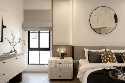 Modern bedroom with stylish decor and natural light