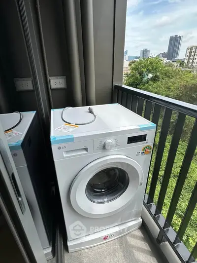 Modern apartment balcony with washing machine and city view