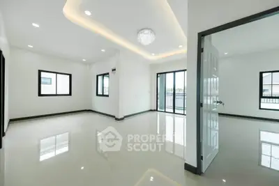 Spacious modern living room with elegant lighting and large windows