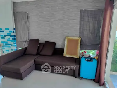 Cozy living room with modern sofa and stylish decor, perfect for relaxation and comfort.