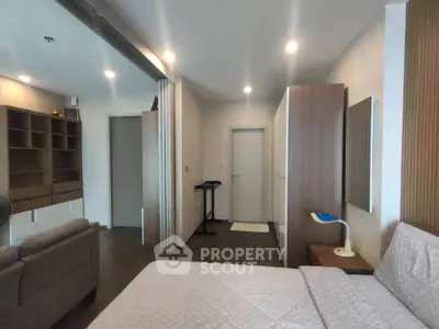 Spacious modern bedroom with elegant decor and ample storage space