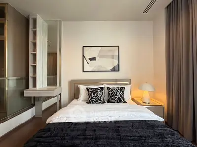 Modern bedroom with stylish decor and cozy ambiance, featuring a comfortable bed and elegant furnishings.