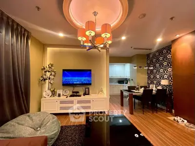 Stylish living room with modern decor and open kitchen layout