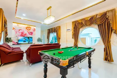 Luxurious living room with billiard table and elegant decor