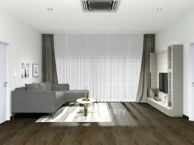 Modern living room with sleek gray sofa and stylish entertainment unit