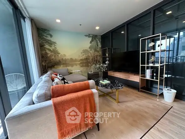 Stylish modern living room with large windows and elegant decor.