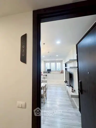 Modern apartment entrance with stylish interior and cozy living area