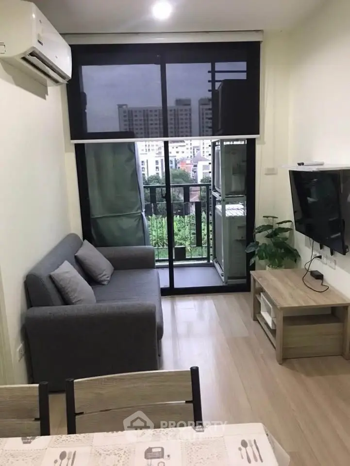 Modern living room with balcony view in urban apartment