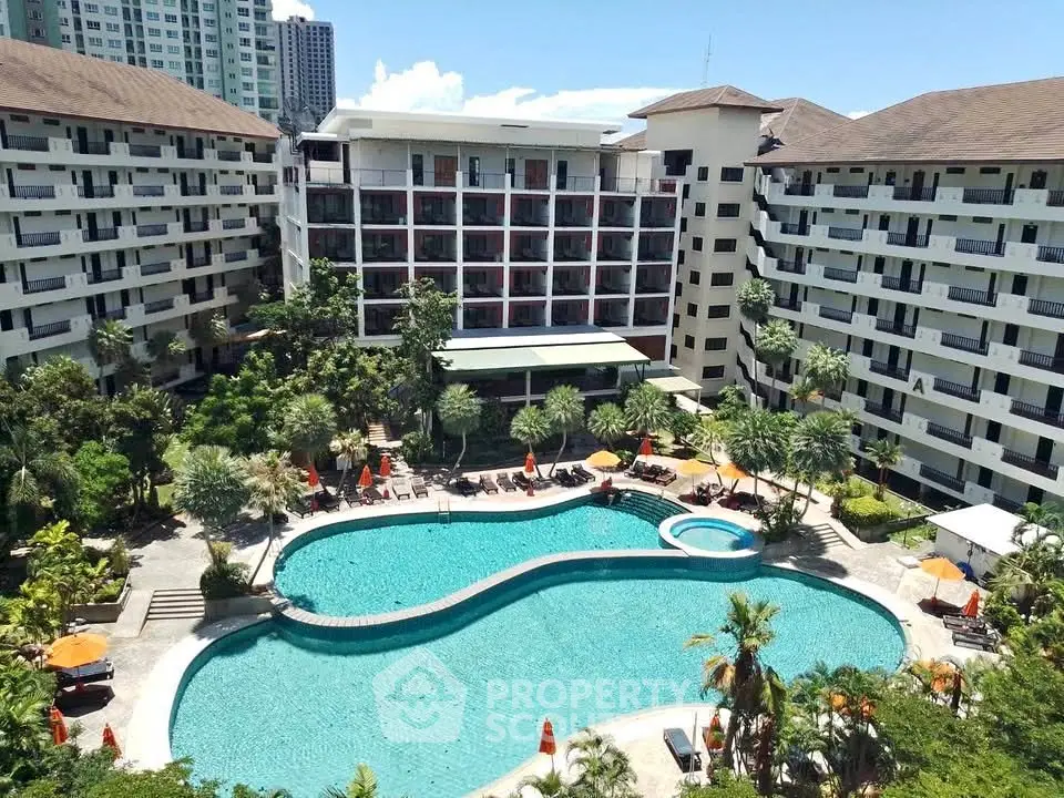 Luxurious condominium complex with stunning pool and lush landscaping, perfect for resort-style living.