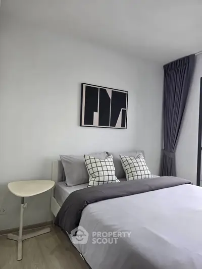 Modern bedroom with stylish decor and natural light