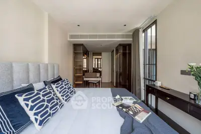 Luxurious bedroom with modern decor and elegant furnishings in a stylish apartment.