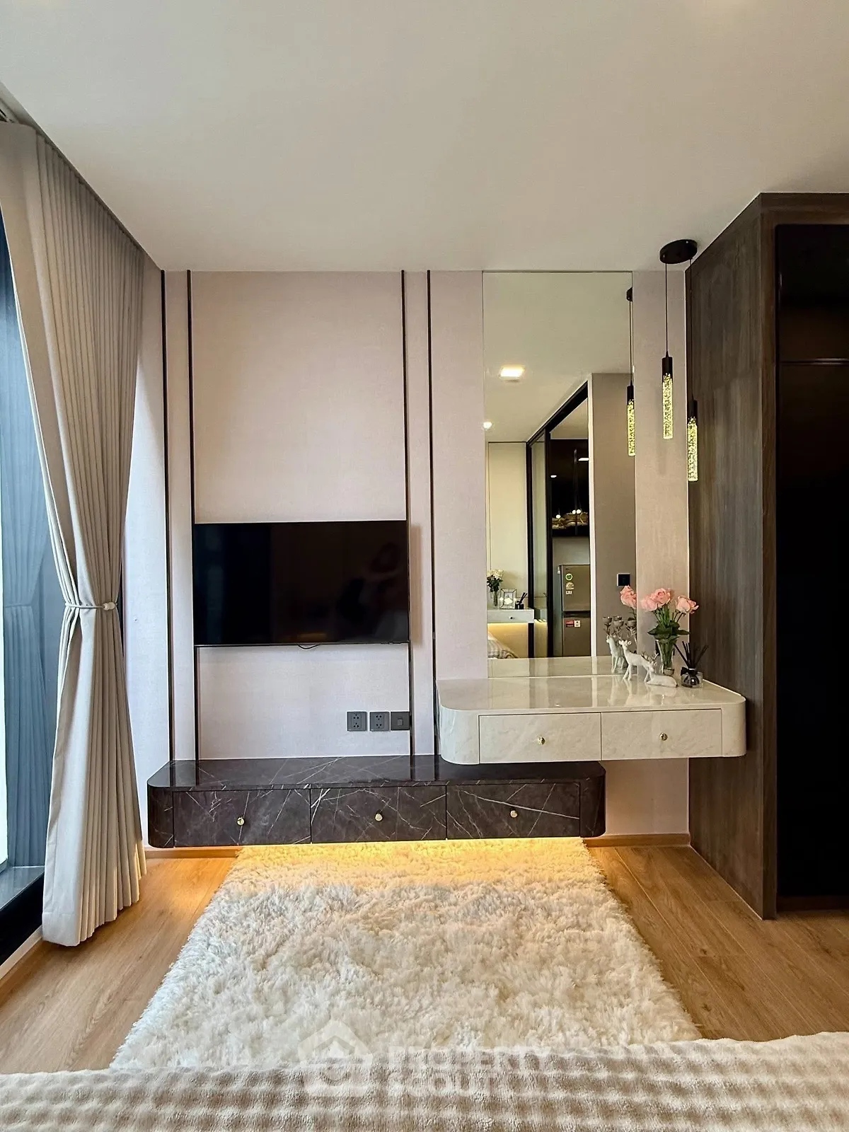 Luxurious modern living room with elegant decor and large window view