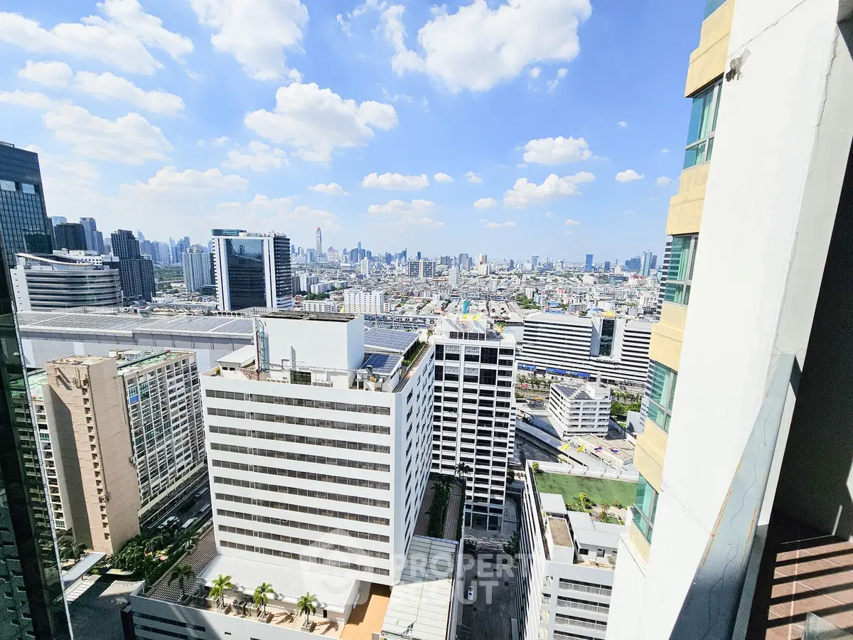 Stunning cityscape view from high-rise building balcony on a clear day