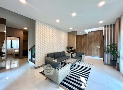 Spacious modern living room with stylish decor and ample natural light