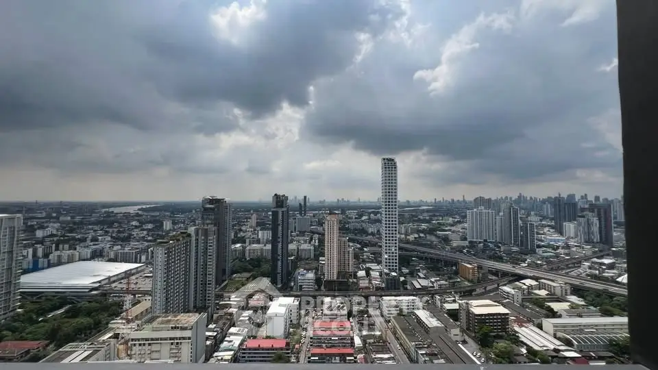 Stunning cityscape view from high-rise building with dramatic clouds